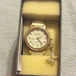 White STRADA women’s watch w/ hanging butterfly
